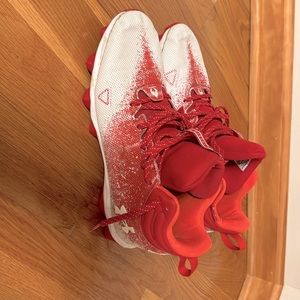 Men’s boys under Armour, football shoes, cleats, red, and white locked down